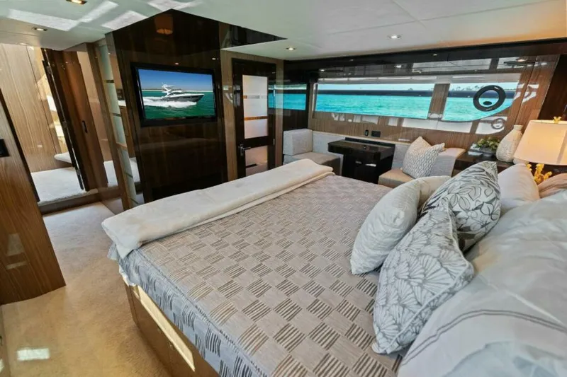  Yacht Photos Pics Luxurious 2018 Cruisers Yachts 60 Fly bedroom with ocean view and modern decor.