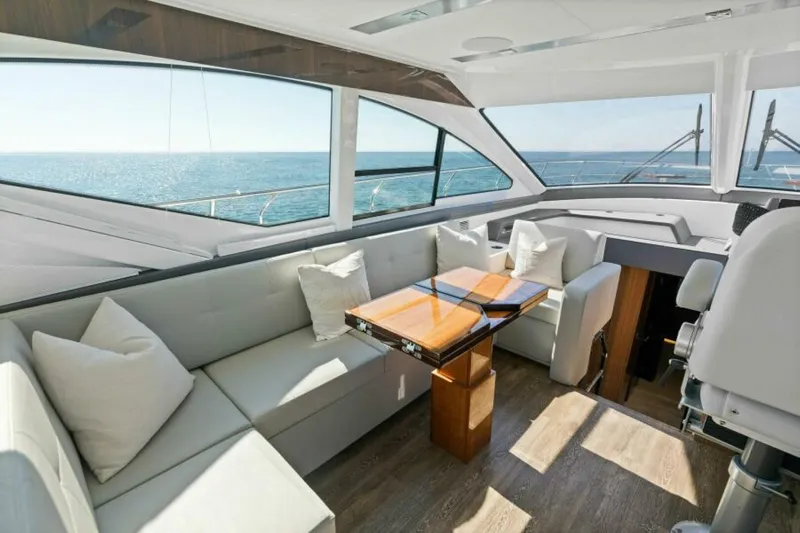  Yacht Photos Pics Luxurious interior of 2018 Cruisers Yachts 60 Fly with ocean view and elegant seating.