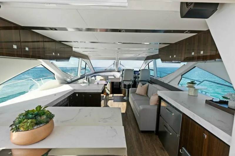  Yacht Photos Pics Luxurious interior of 2018 Cruisers Yachts 60 Fly with modern furnishings and ocean view.