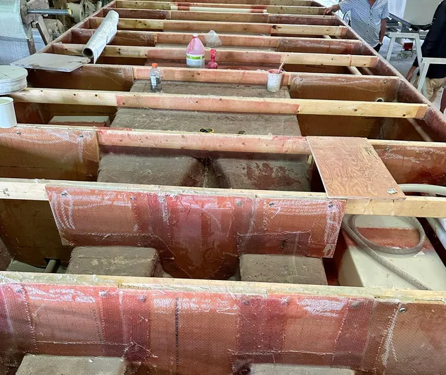 Tiki International Yacht Photos Pics 2023 Beachcat 26 Tiki COI under construction, showcasing interior framework and materials.