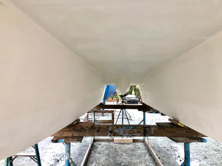 Tiki International Yacht Photos Pics Underneath view of 2023 Beachcat 26 Tiki COI catamaran on supports.