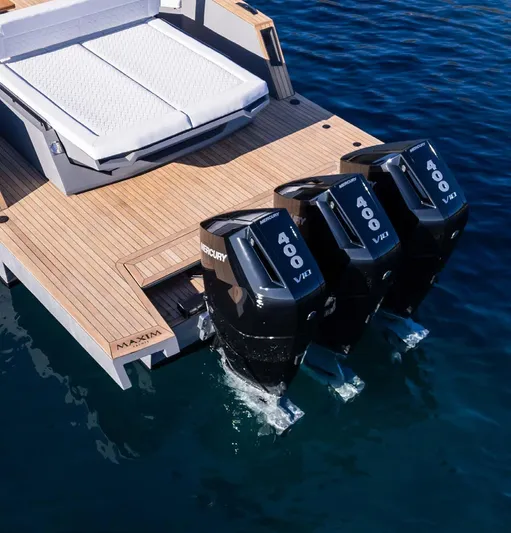 Max44r Yacht Photos Pics 2025 Maxim Yachts MAX44R with triple Mercury 400 engines on a sleek wooden deck.