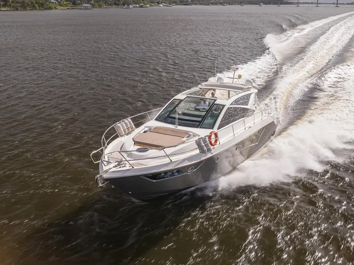 Dominus Yacht Photos Pics 2012 Cranchi 56 yacht cruising on open water.