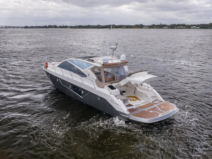 Dominus Yacht Photos Pics 2012 Cranchi 56 yacht cruising on a cloudy day.