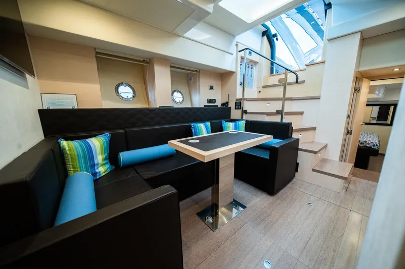 Dominus Yacht Photos Pics Luxurious interior of 2012 Cranchi 56 yacht with modern seating and dining area.