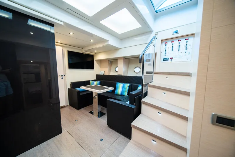 Dominus Yacht Photos Pics Interior of 2012 Cranchi 56 yacht with modern seating and dining area.