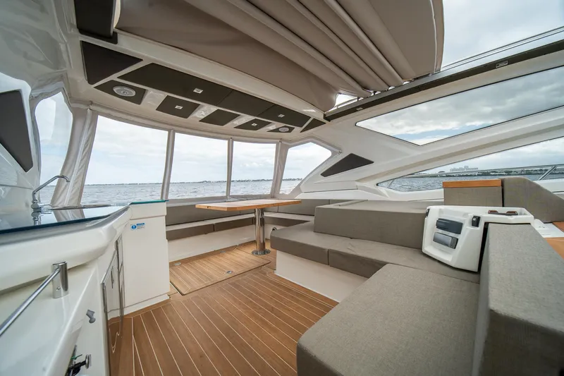 Dominus Yacht Photos Pics Luxurious interior of 2012 Cranchi 56 yacht with panoramic windows and modern seating.