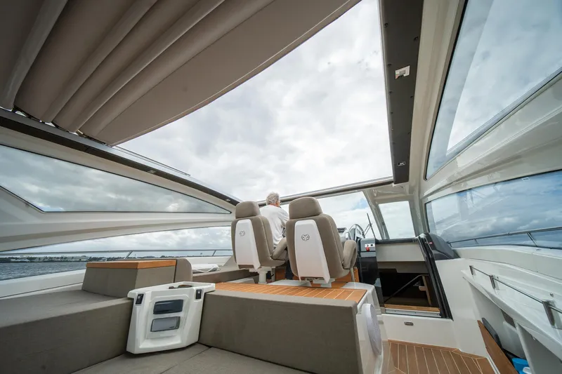 Dominus Yacht Photos Pics 2012 Cranchi 56 yacht interior with panoramic windows and modern seating.