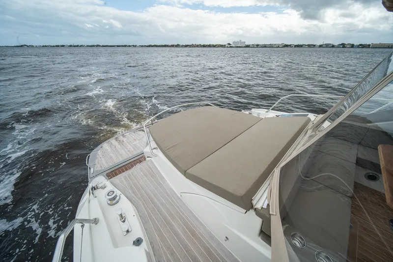 Dominus Yacht Photos Pics 2012 Cranchi 56 yacht with spacious sun deck on open water.