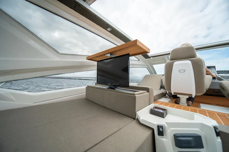 Dominus Yacht Photos Pics 2012 Cranchi 56 yacht interior with TV and panoramic windows.