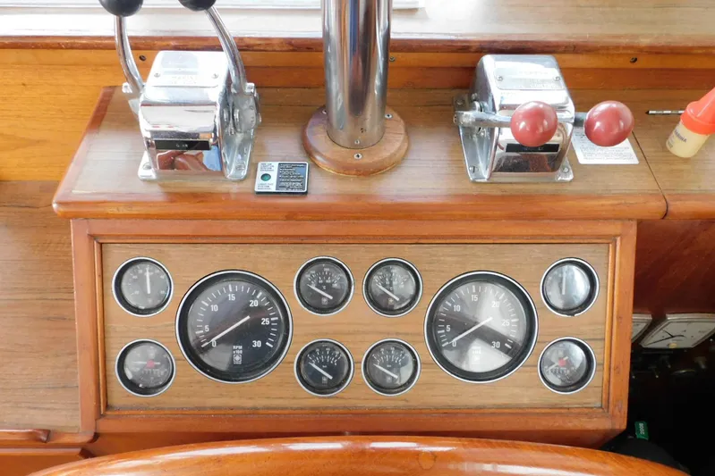 Susan Gail Yacht Photos Pics Control panel of a 1986 Grand Banks 46 Classic yacht with gauges and throttle levers.