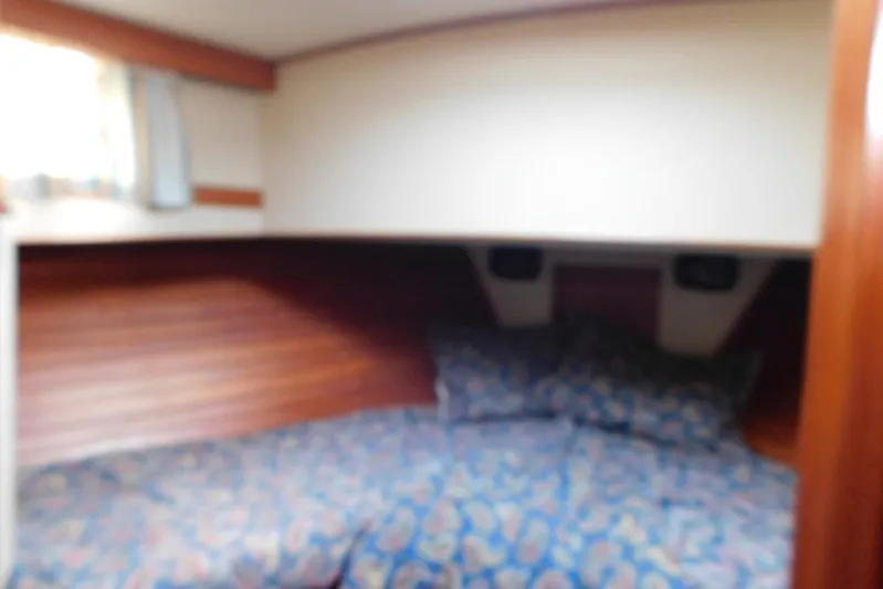 Susan Gail Yacht Photos Pics Cozy cabin interior of 1986 Grand Banks 46 Classic yacht with patterned bedding.