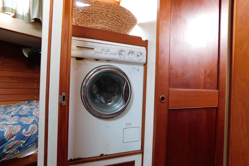 Susan Gail Yacht Photos Pics Laundry area inside 1986 Grand Banks 46 Classic yacht with wooden cabinetry.