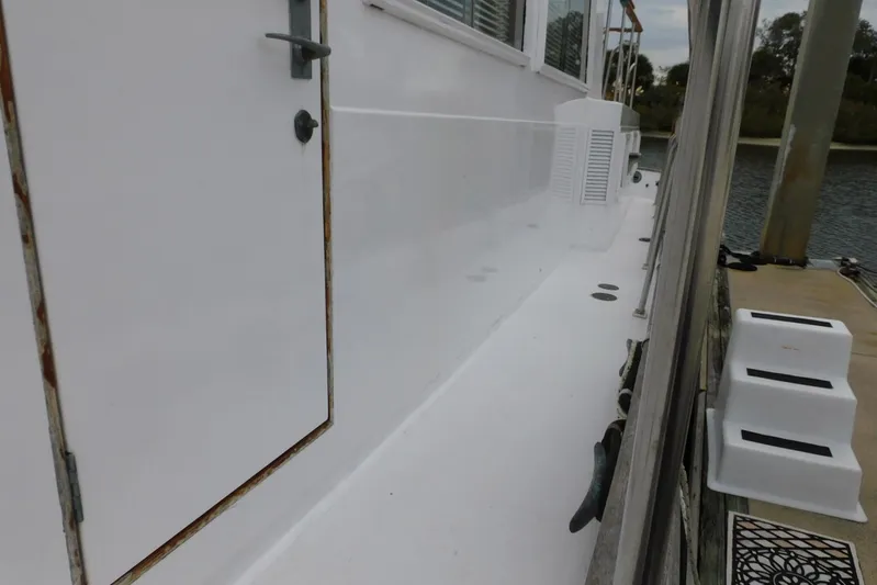 Susan Gail Yacht Photos Pics Side view of 1986 Grand Banks 46 Classic yacht docked by the water.