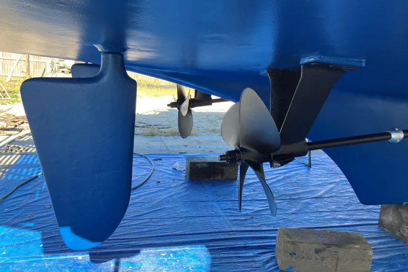 Susan Gail Yacht Photos Pics 1986 Grand Banks 46 Classic boat propeller and rudder, freshly painted blue.