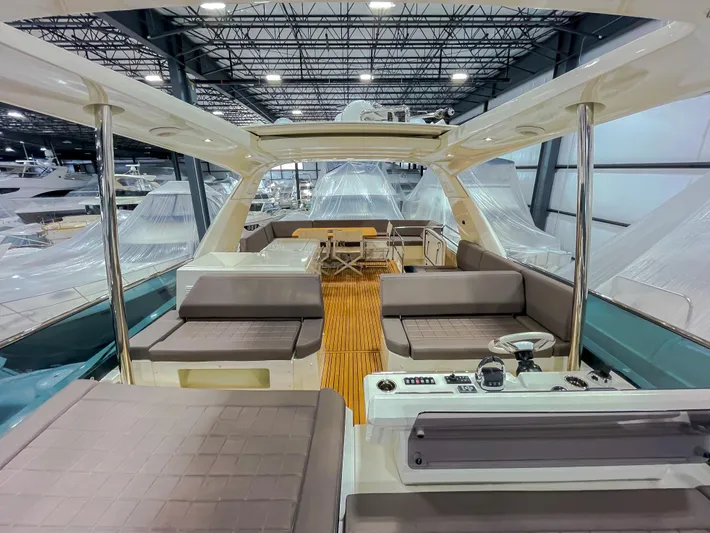 Total Package Yacht Photos Pics Luxurious 2016 Prestige 680 Flybridge yacht interior with spacious seating and modern design.