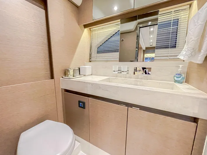 Total Package Yacht Photos Pics Luxurious bathroom in 2016 Prestige 680 Flybridge yacht with modern fixtures and elegant design.