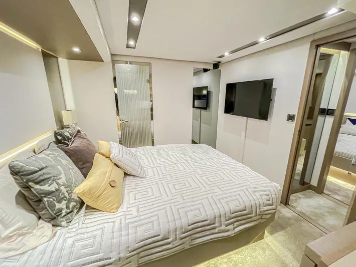 Total Package Yacht Photos Pics Luxurious bedroom interior of 2016 Prestige 680 Flybridge yacht with modern decor and amenities.