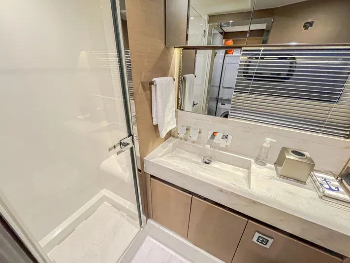 Total Package Yacht Photos Pics Luxurious bathroom in 2016 Prestige 680 Flybridge yacht with modern fixtures and elegant design.