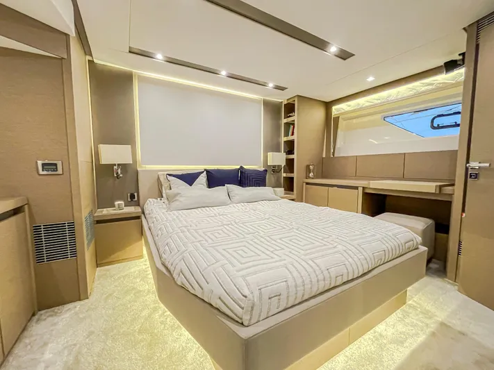 Total Package Yacht Photos Pics Luxurious bedroom interior of 2016 Prestige 680 Flybridge yacht with modern design and cozy ambiance.