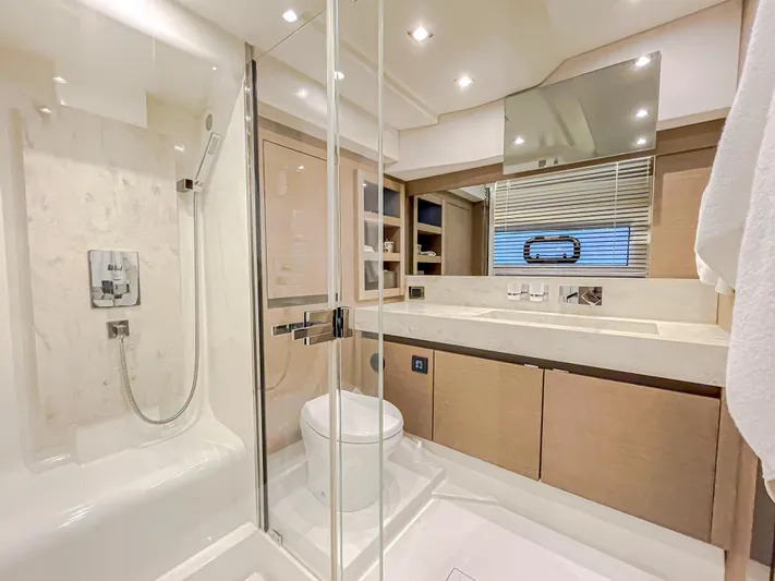 Total Package Yacht Photos Pics Luxurious bathroom in 2016 Prestige 680 Flybridge yacht with modern fixtures and elegant design.