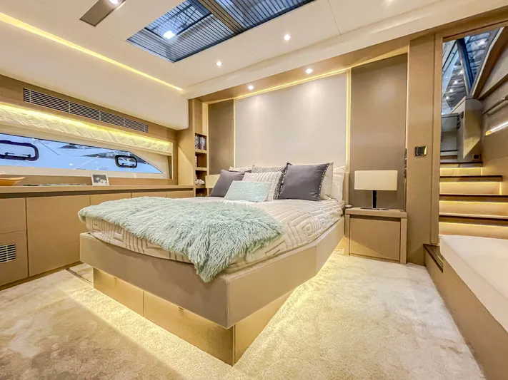 Total Package Yacht Photos Pics Luxurious bedroom interior of 2016 Prestige 680 Flybridge yacht with modern design and skylight.