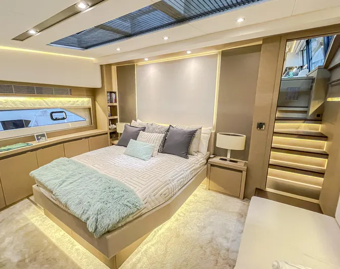 Total Package Yacht Photos Pics Luxurious bedroom interior of 2016 Prestige 680 Flybridge yacht with modern design and ambient lighting.