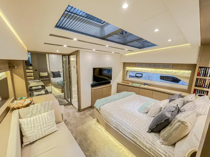 Total Package Yacht Photos Pics Luxurious interior of 2016 Prestige 680 Flybridge yacht with modern bedroom and skylight.