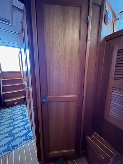 Bay Saddle Yacht Photos Pics Interior of 2005 Sabre 38 Hardtop Express, featuring wooden door and stairs.
