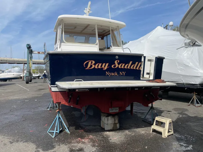 Bay Saddle Yacht Photos Pics 2005 Sabre 38 Hardtop Express boat named "Bay Saddle" in a marina, Nyack, NY.