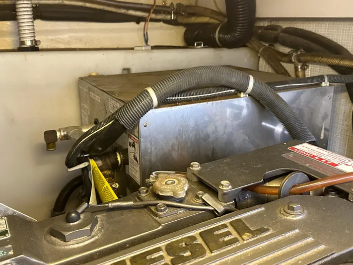 Bay Saddle Yacht Photos Pics Engine compartment of a 2005 Sabre 38 Hardtop Express boat, featuring diesel components.