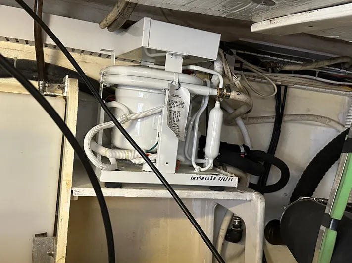 Bay Saddle Yacht Photos Pics Engine room of 2005 Sabre 38 Hardtop Express with visible mechanical components and wiring.