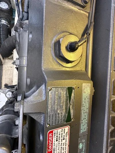 Bay Saddle Yacht Photos Pics Engine compartment of a 2005 Sabre 38 Hardtop Express with warning labels.