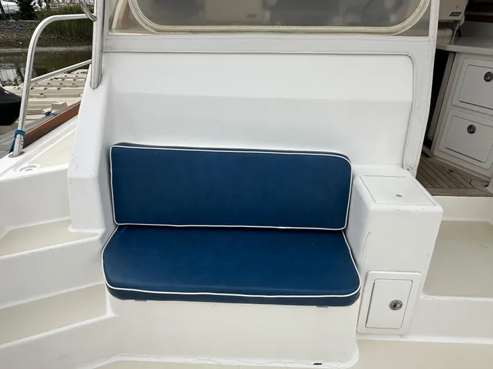 Bay Saddle Yacht Photos Pics 2005 Sabre 38 Hardtop Express boat seat with blue cushion and white trim.