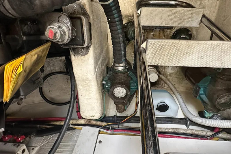 Bay Saddle Yacht Photos Pics Engine compartment of a 2005 Sabre 38 Hardtop Express with visible wiring and components.