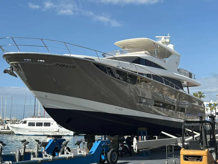 Princess Of The Seas Yacht Photos Pics 2017 Jeanneau Prestige 750 yacht docked at marina under clear blue sky.