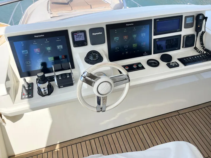 Princess Of The Seas Yacht Photos Pics Cockpit of 2017 Jeanneau Prestige 750 yacht with advanced navigation displays and controls.