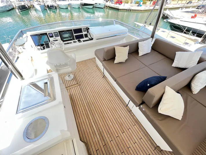 Princess Of The Seas Yacht Photos Pics Luxurious Jeanneau Prestige 750 yacht interior with plush seating and modern controls, 2017 model.