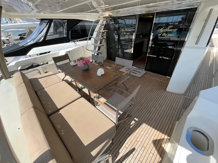 Princess Of The Seas Yacht Photos Pics Luxurious 2017 Jeanneau Prestige 750 yacht deck with elegant seating and dining area.