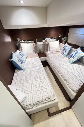 Princess Of The Seas Yacht Photos Pics Luxurious cabin interior of 2017 Jeanneau Prestige 750 yacht with twin beds and elegant decor.