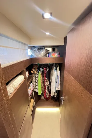 Princess Of The Seas Yacht Photos Pics Walk-in closet on 2017 Jeanneau Prestige 750 yacht with clothes and storage.