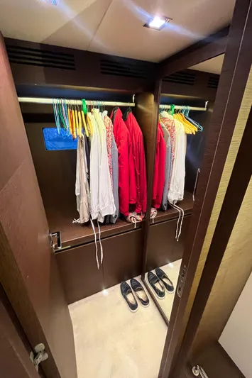 Princess Of The Seas Yacht Photos Pics Closet interior on 2017 Jeanneau Prestige 750 yacht with clothes and shoes.