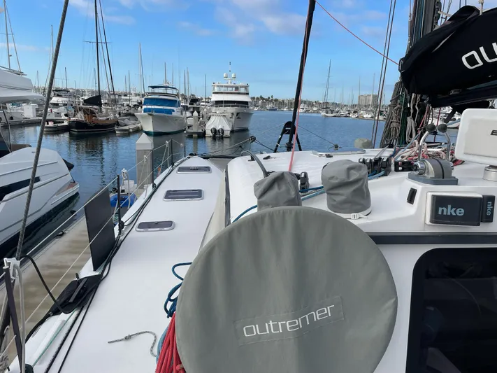 Inconceivable Yacht Photos Pics 2018 Outremer 4X catamaran docked in a marina with other boats.