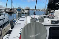 2018 Outremer 4X catamaran docked in a marina with other boats.