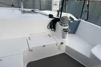 2018 Outremer 4X yacht deck with seating, ropes, and marina view.