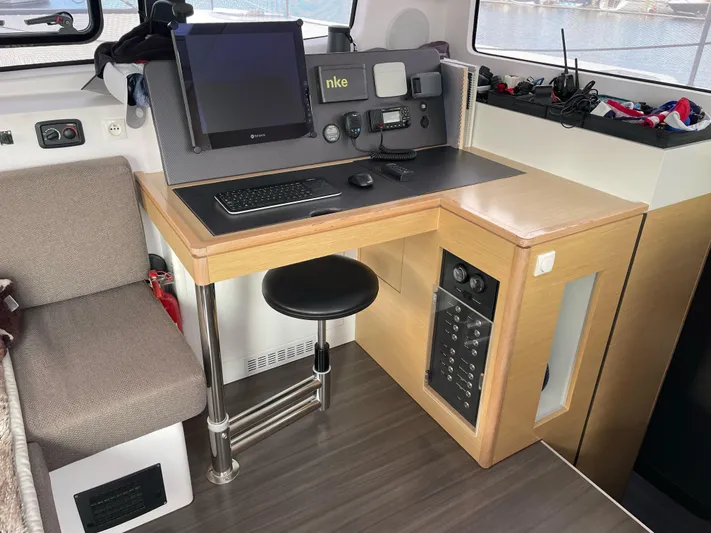Inconceivable Yacht Photos Pics Navigation station in 2018 Outremer 4X catamaran with control panel and seating.