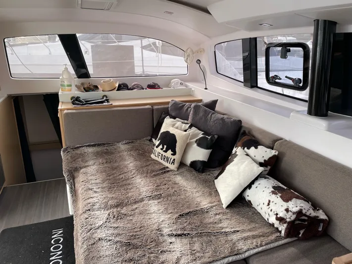 Inconceivable Yacht Photos Pics Interior of 2018 Outremer 4X catamaran with cozy seating and decorative pillows.