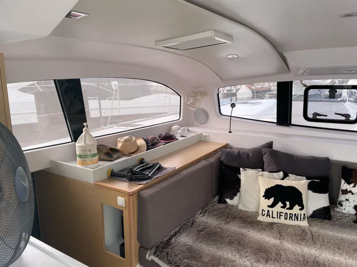 Inconceivable Yacht Photos Pics Interior of 2018 Outremer 4X catamaran with cozy seating and California-themed decor.