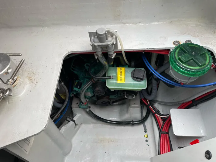 Inconceivable Yacht Photos Pics Engine compartment of a 2018 Outremer 4X catamaran with visible wiring and components.