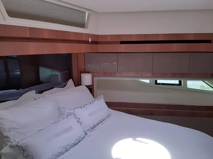  Yacht Photos Pics Luxurious bedroom interior of 2020 Intermarine 80 yacht with modern design and elegant bedding.